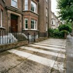 a concrete driveway after pressure washing with a “zebra striping” effect