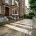 a concrete driveway after pressure washing with a “zebra striping” effect