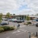 a large supermarket forecourt in North London on a quiet Wednesday afternoon